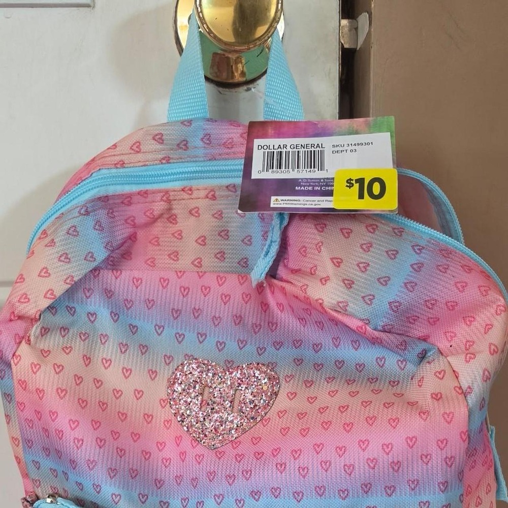 Pink and blue heart patterned backpack with glitter heart
